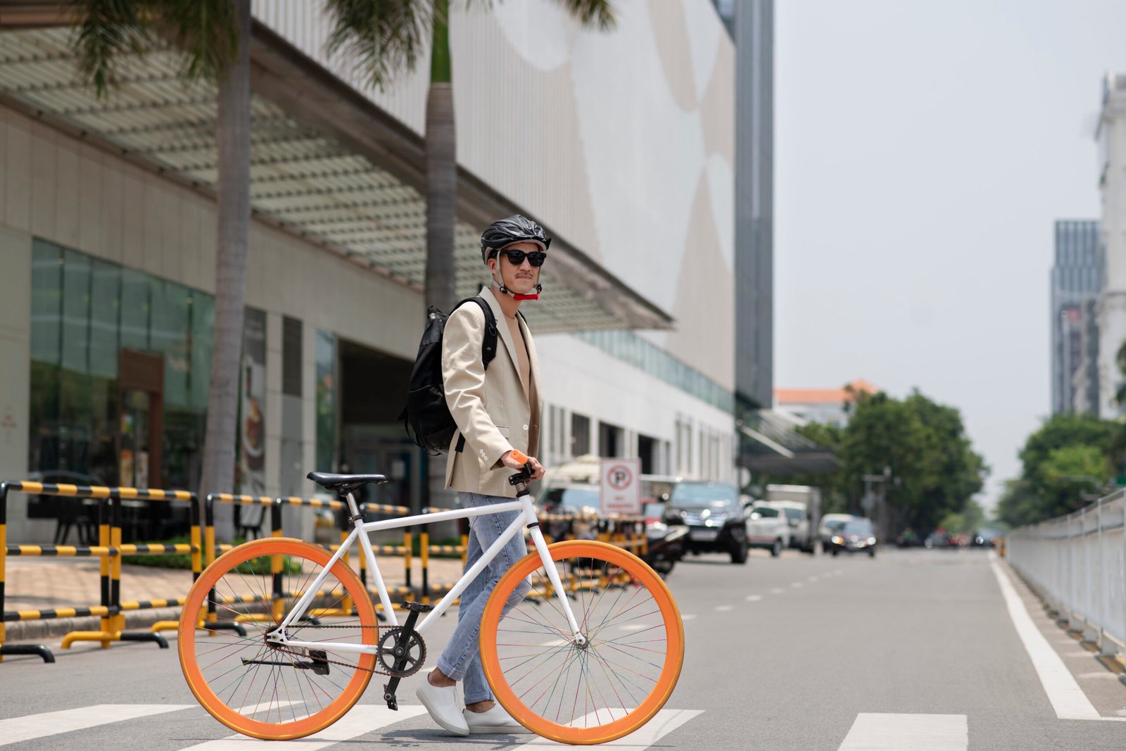 full-shot-man-walking-with-bicycle